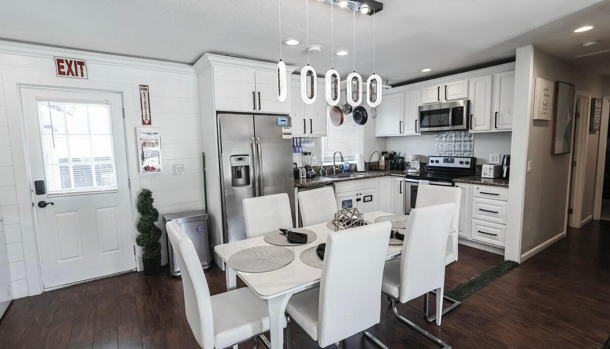 Elegant dining area in the living room with a stylish table and chairs, perfect for enjoying meals and socializing.